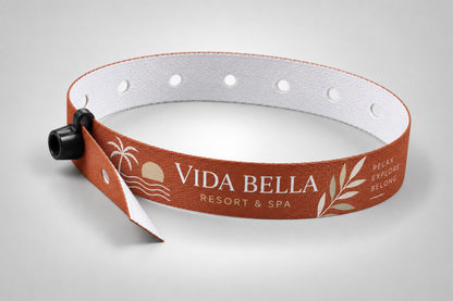 Orange fabric wristband with snap lock and printed resort logo