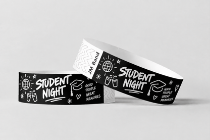 Two black paper wristbands with white student night print