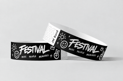 Two black paper wristbands with white festival print