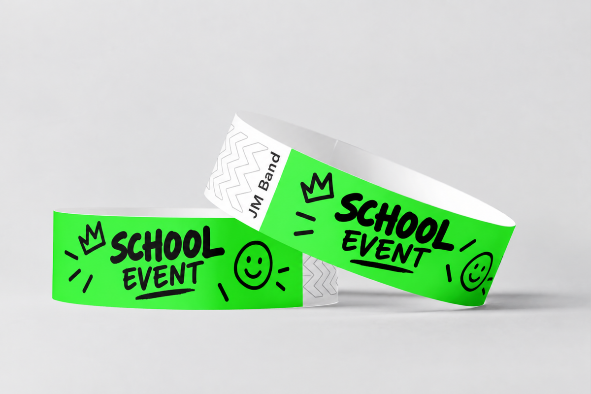 Two neon green paper wristbands printed with school event design