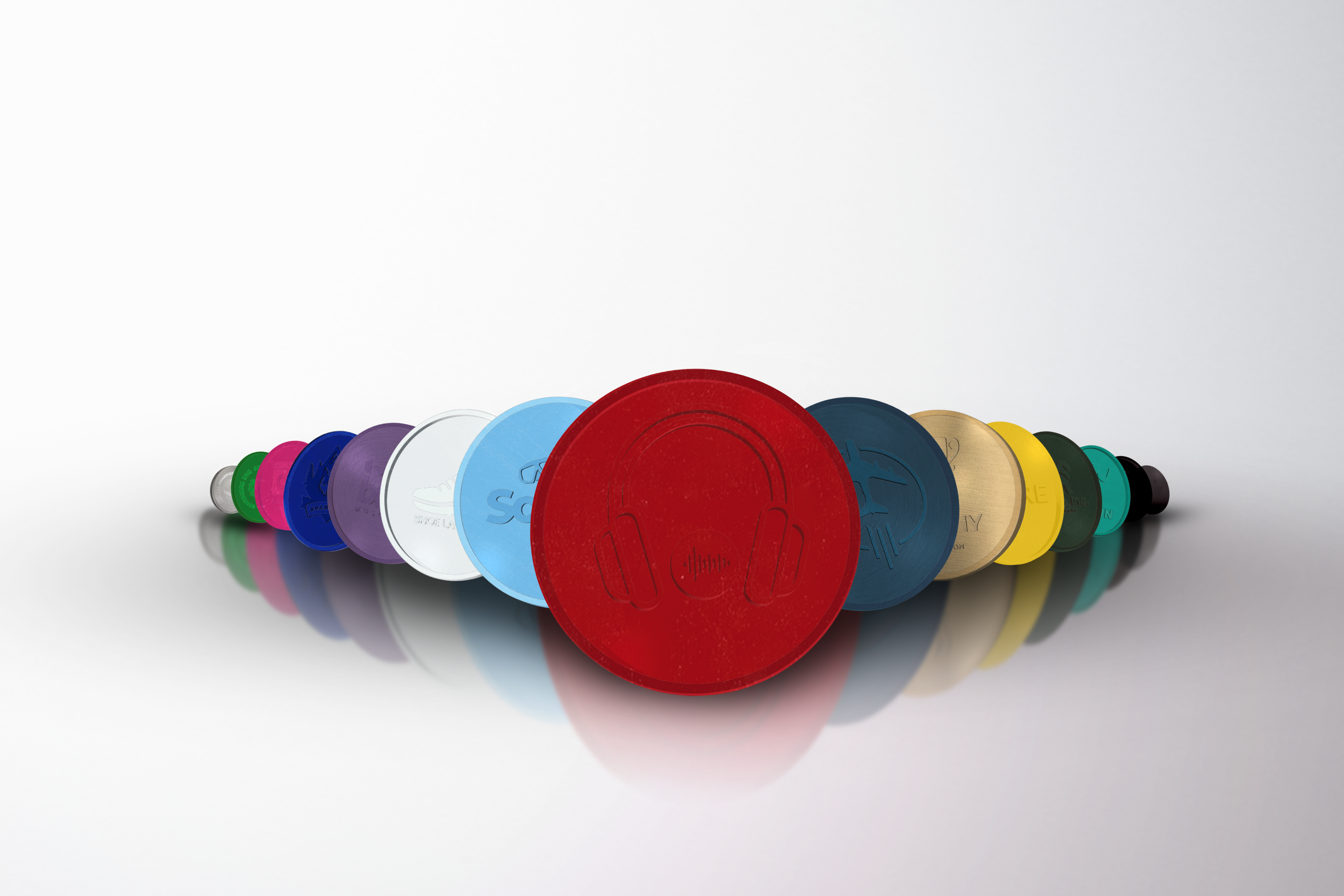 An image displaying a row of vibrant coloured, personalised plastic tokens.