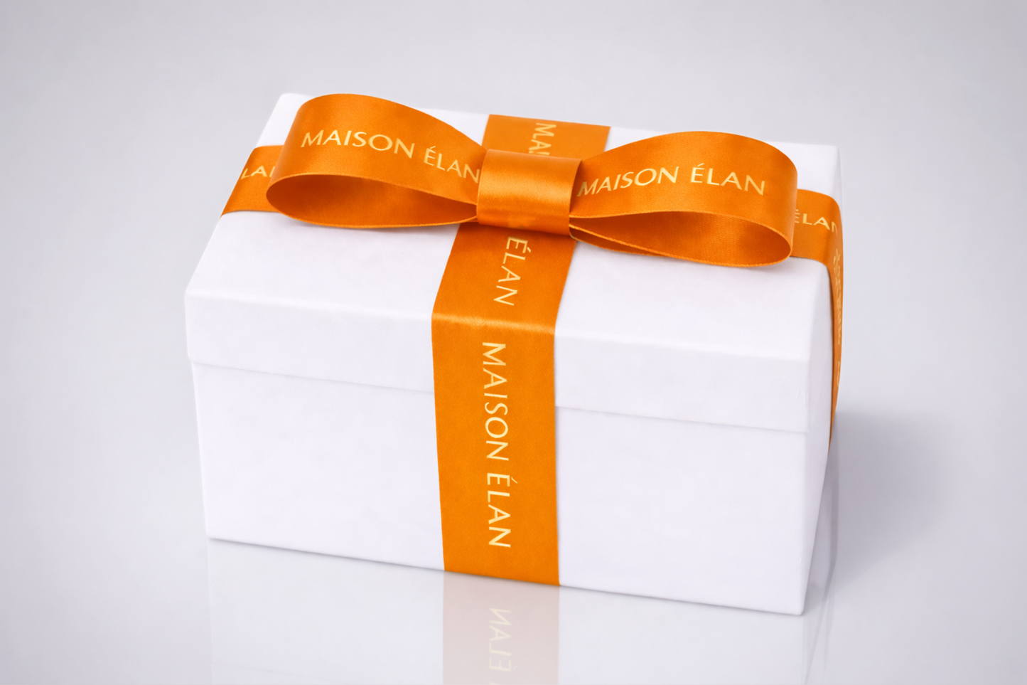 Wide orange gift ribbon with print from JM Band®.
