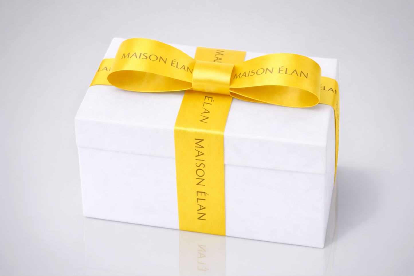 Wide yellow gift ribbon with print from JM Band®.