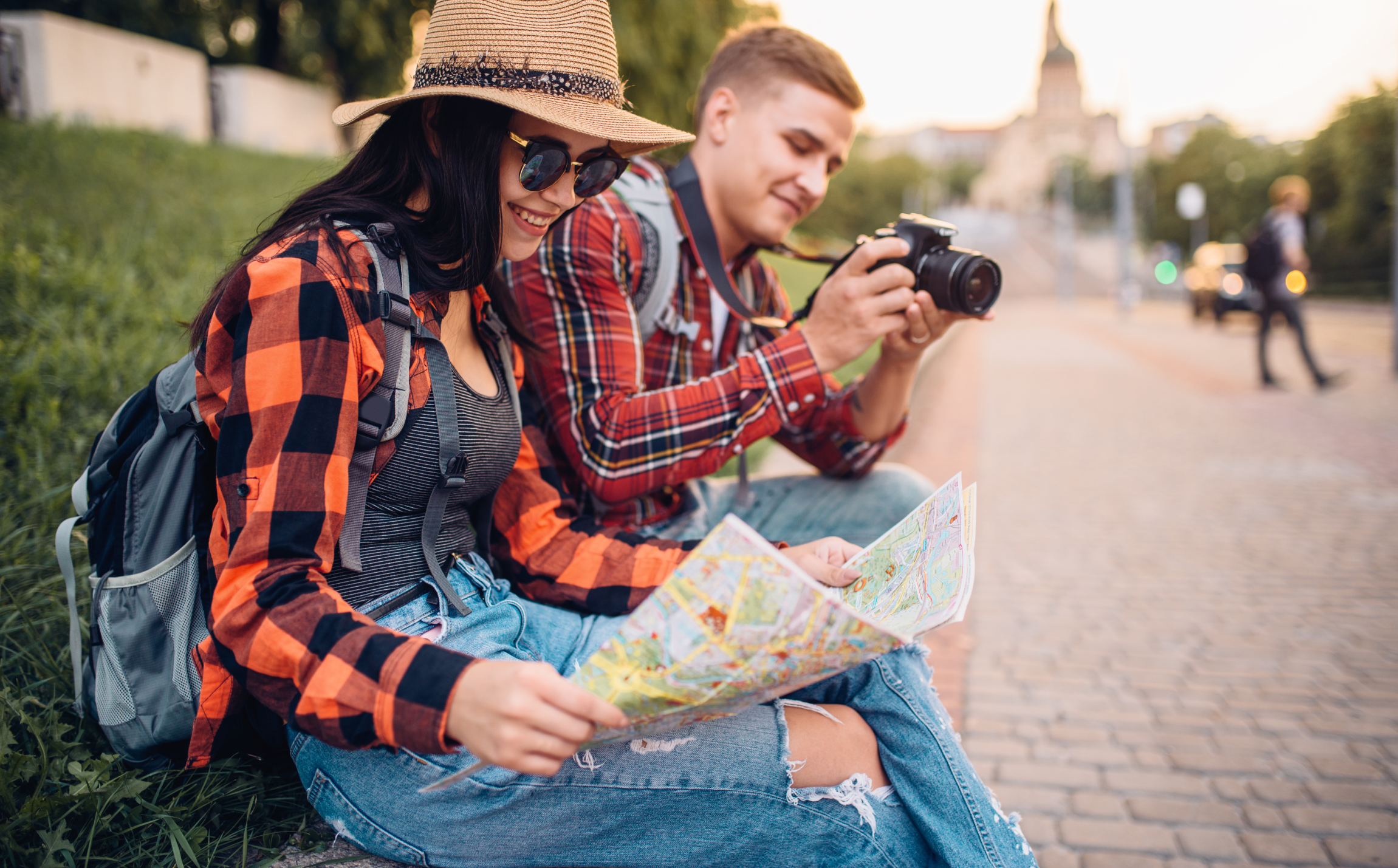 couple of tourists study the map of attractions